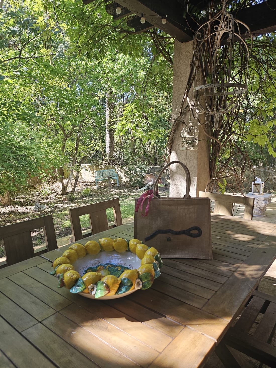 A burlap tote resting on a garden table