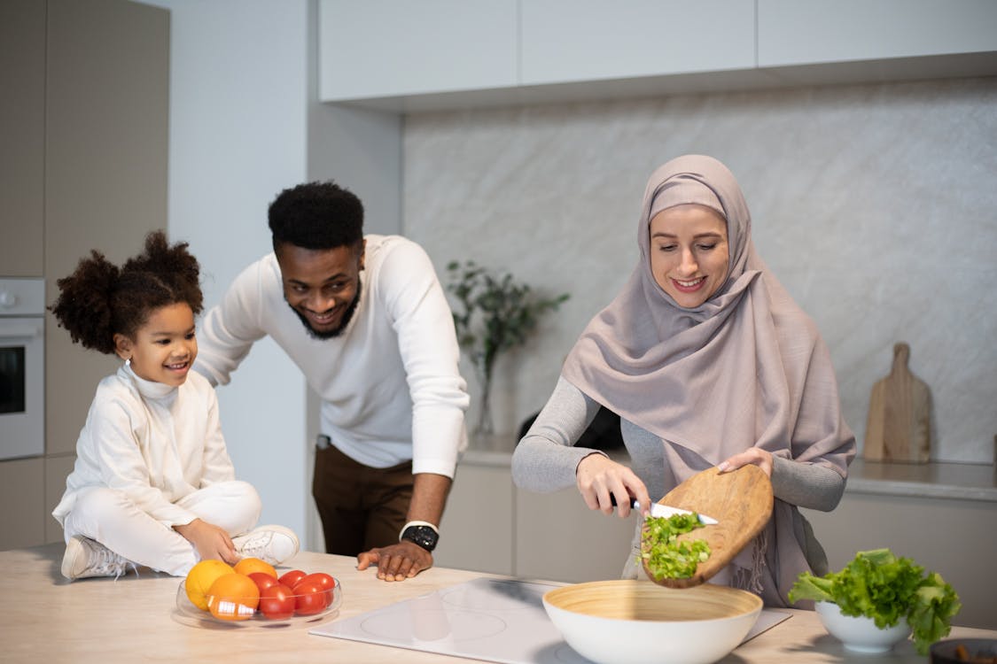 Hope Kitchen refugee women plating meals