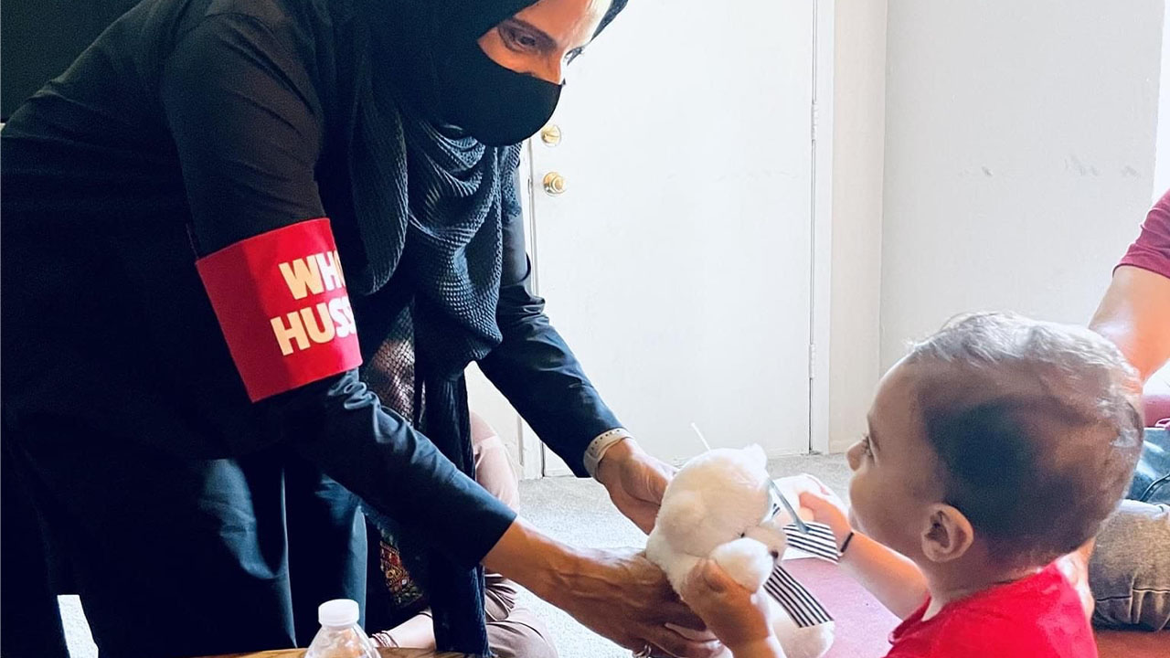 Volunteer helping a child